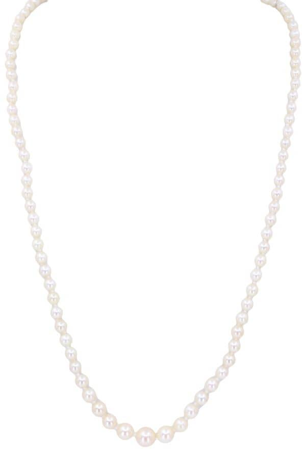 COLLIER DE PERLES EN CHUTE, photo 2 sur 3
